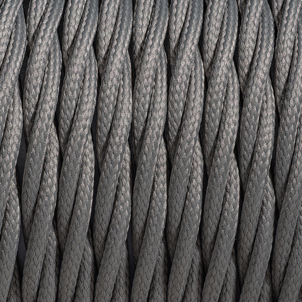 A macro photograph of interwoven braided cables, representing the structural integration of creator partnerships and consolidated rights management.
