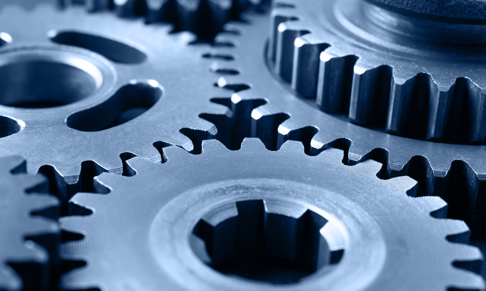 A macro photograph of interlocking industrial gears, representing the partner ecosystem as the high-yield distribution architecture for modern B2B growth.